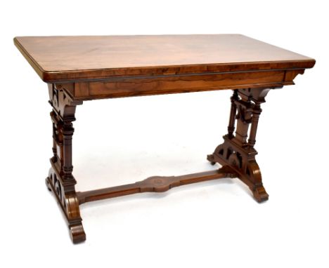 A good and large Victorian rosewood card table with green baize lined top and brass hinges on elaborate carved stretchered su