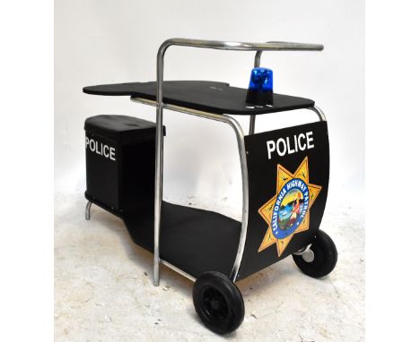 A trolley converted to a desk with painted California Highway Patrol insignia, with working blue flashing light, length 116cm