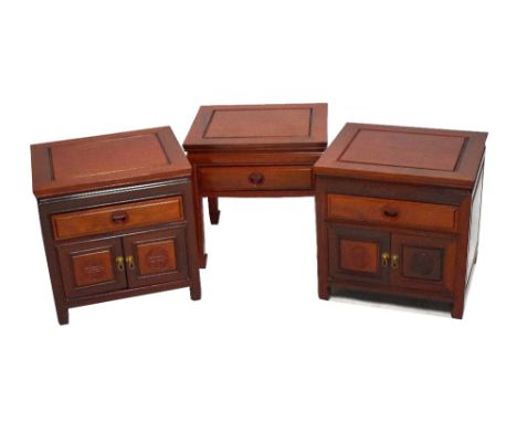 A pair of reproduction Chinese rosewood cabinets of square form, with single drawer above two panelled cupboard doors togethe