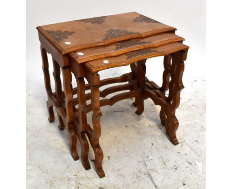 A nest of three Indian teak tables with carved foliate detail on shaped legs, width of largest 50.5cm.Additional InformationP
