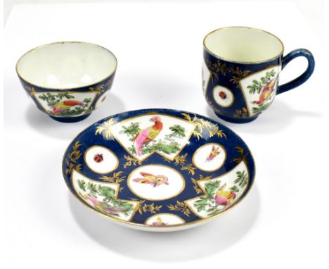 WORCESTER; an 18th century first period trio, with blue ground and fan shaped panels set with exotic birds, butterflies and i