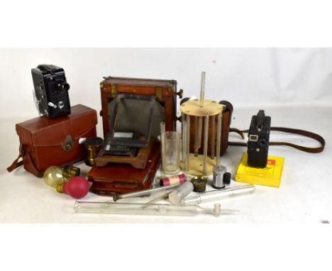 A group of early 20th century camera equipment, a cine camera, a pathoscope in leather case, etc.