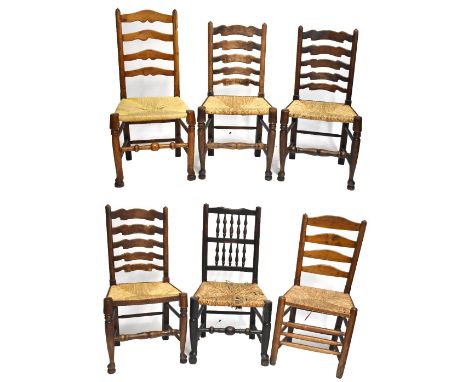 Six assorted ladder back rush seated dining chairs (6).