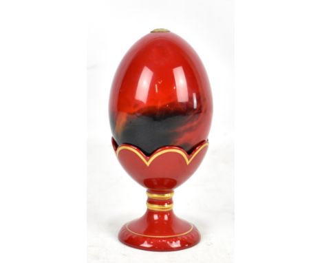 ROYAL DOULTON; a flambé egg and cup with gilt detail, printed marks and no.2908 to cup base, height of both 14.8cm.Additional