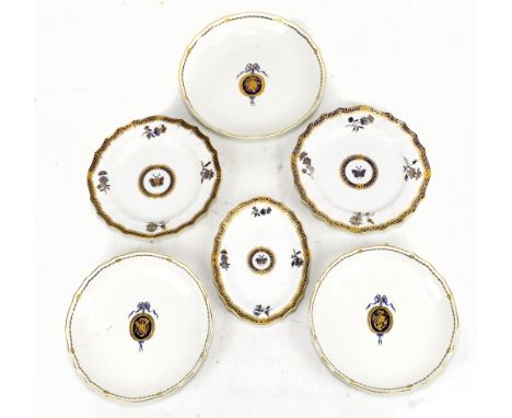 A pair of 19th century Continental shallow bowls with gilt heightened Greek key decorated border and central panel set with a