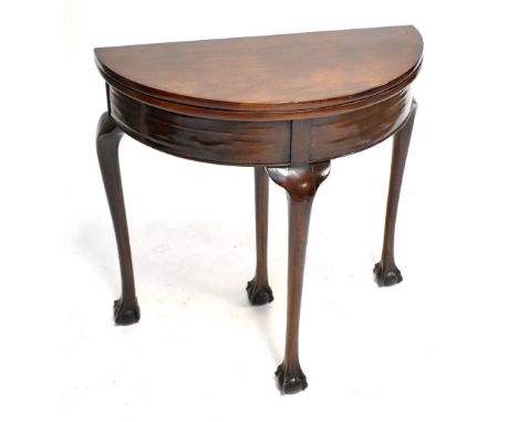 A mahogany demi-lune card table.