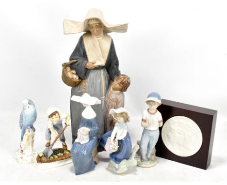 LLADRO; four assorted figures including mother and child, height 40cm, circular plaque, also two Royal Worcester figures incl