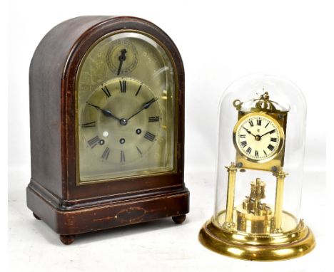 An early 20th century mahogany cased bracket clock, the silvered brass dial with Roman numerals, raised on bun feet, height 3