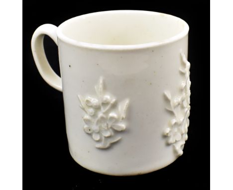 BOW; an 18th century blanc de chine coffee can with applied prunus decoration, height 5.75cm.Provenance: from a private Worce