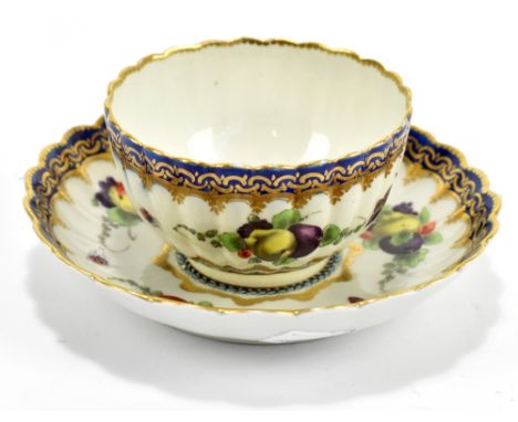 WORCESTER; an 18th century first period tea bowl and saucer decorated in the 'Lord Henry Thyme' pattern, with landscape vigne