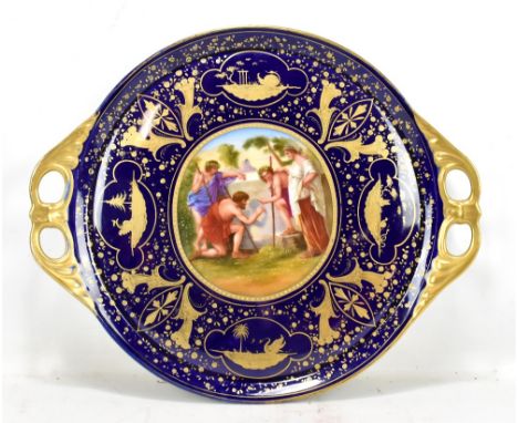 VIENNA PORCELAIN; a twin handled circular tray with central panel depicting figures in landscape inside gilt musical instrume