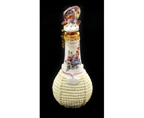 CHELSEA; a rare mid-18th century scent bottle in the form of a wine flask, with butterfly stopper and painted with floral spr