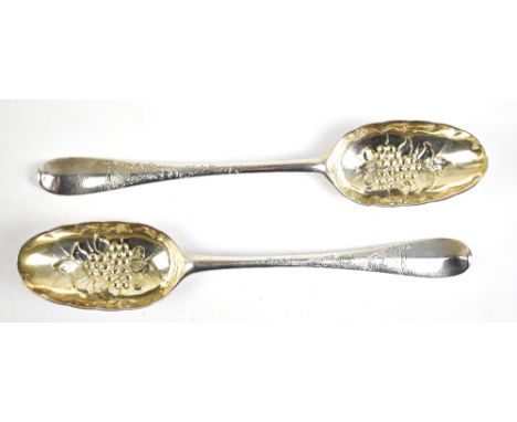 HUGH GORDON; a pair of George II Scottish hallmarked silver tablespoons, later embossed to berry spoons with engraved detail,