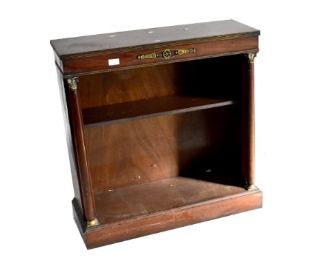 A small mahogany open bookcase with brass detail and single shelf flanked by Corinthian column supports.