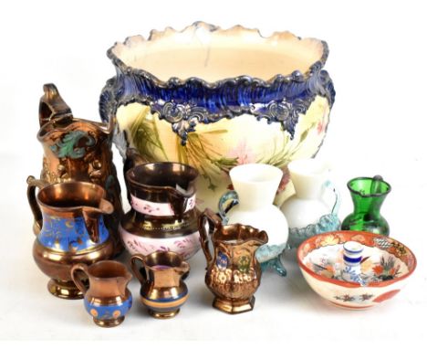 A Victorian ceramic jardinière with floral decoration, six lustre jugs, etc.