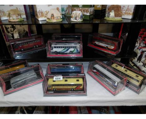 Ten 1:76 scale Corgi The Original Omnibus Company limited edition die cast buses in sealed display boxes.