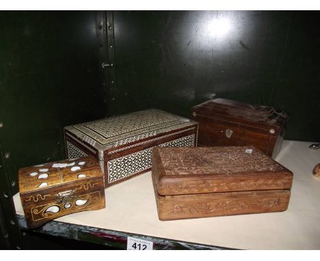 A Victorian tea caddy, a carved teak box and 2 inlaid boxes.