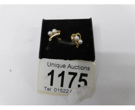 A pair of 9ct yellow gold pearl earrings.