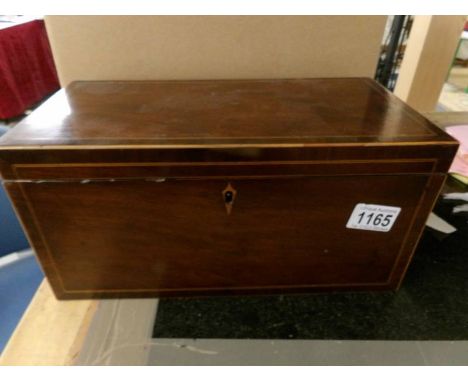A superb quality mahogany inlaid tea caddy in good condition and complete with original mixing bowl.