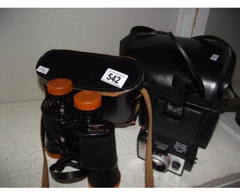 A vintage Polaroid square shooter 2 instant camera and a Swift tecnar 8 x 40 binoculars.