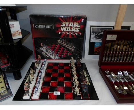 A boxes Star Wars Episode 1 chess set (1 Obi Wan Kanobe light sabre broken or missing).