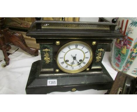 A Victorian palladian style mantel clock.