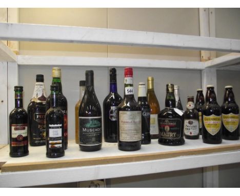 A large shelf of various alcohol.