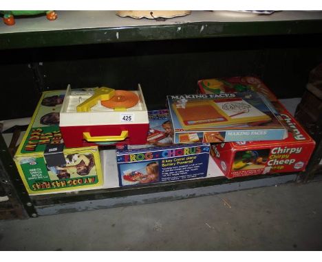 A quantity of old children's toys including Fisher Price music box record player.