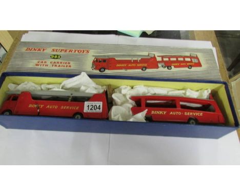 A Dinky 983 car carrier with trailer, in very good condition and in original box.