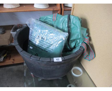 A plastic faux wood barrel planter etc