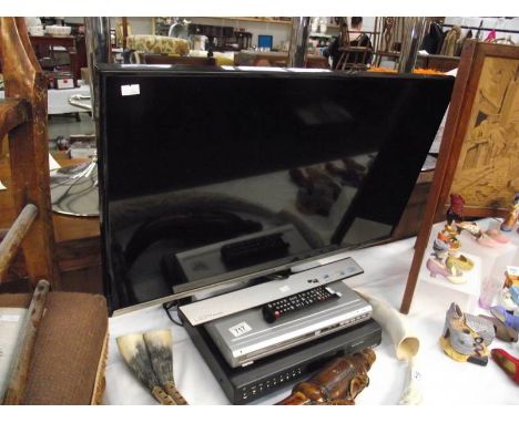 A Samsung LED TV monitor with DVD player and digital TV recorder.