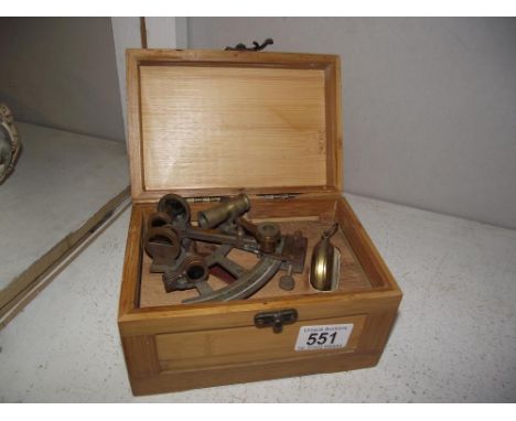 A cased brass Kelvin &amp; Hughes sextant and compass.