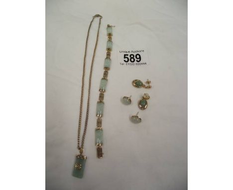 A jade necklace, bracelet and earrings.