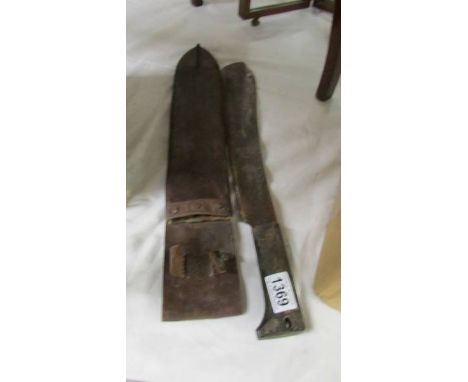 An old machete in scabbard, a/f.