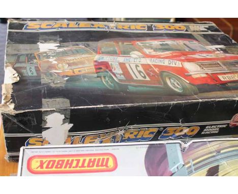 THREE BOXED SCALEXTRIC KITS
together with a Matchbox Power track race kit, largest box 76cm long