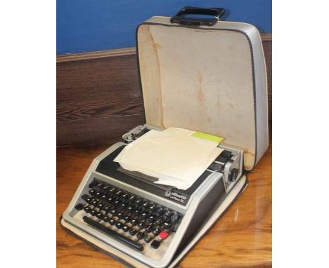 OLIVETTI LETTERA DL TYPEWRITER
inside original canvas case with documents, 30cm wide