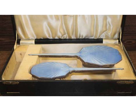 SILVER AND BLUE GUILLOCHE ENAMEL VANITY SET
maker W G Sothers Ltd., Birmingham 1921, comprising a hand mirror, a hair brush a