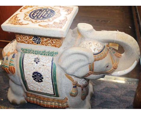 PAIR OF CERAMIC ELEPHANT JARDINIERE STANDS
modelled as a whole elephants saddled with robes and square tops, each 43cm high