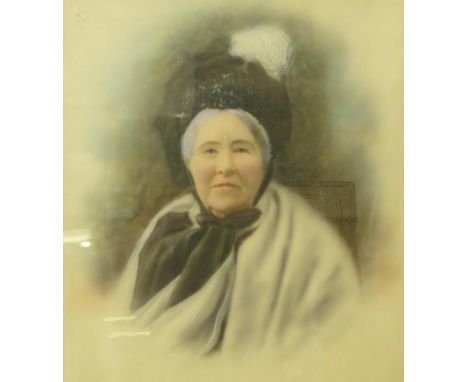 An early 20th Century portrait of a seated lady, overpainted photographic print, framed, 50cm x 40cm