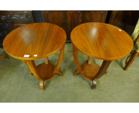 A pair of Art Deco style walnut circular lamp tables
