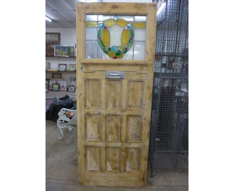 A pine and stained glass door