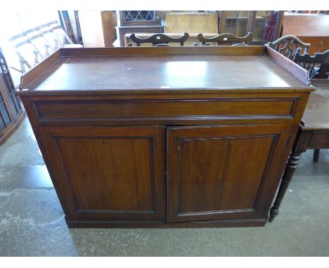 A Victorian mahogany two door cupboard