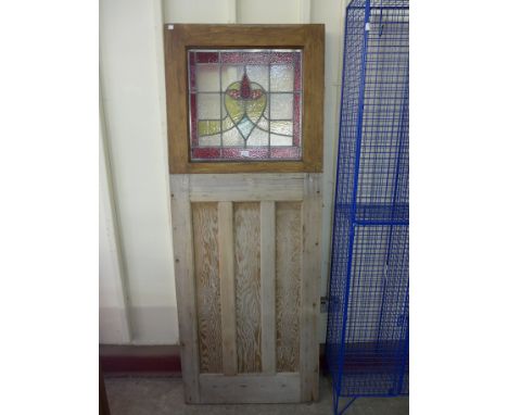 A pine and stained glass door