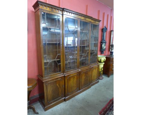 A mahogany four door breakfront bookcase