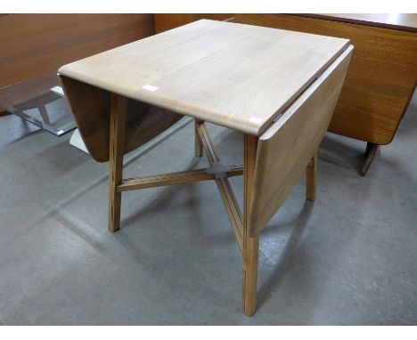 An Ercol drop leaf dining table