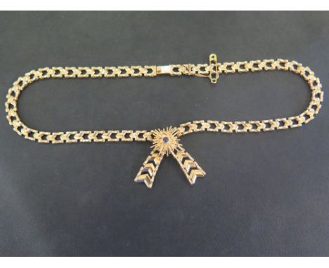 A 9ct gold fancy-link necklace - With cross-over centre and sapphire highlight - Hallmarked London - Length 41cms - Weight ap