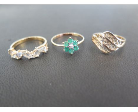 An emerald and diamond daisy cluster ring - Ring size S - Together with a gem-set zig-zag ring and a filigree panel ring - Ri