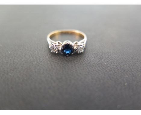 A circular sapphire and single-cut diamond three-stone ring - Stamped 18ct & plat - Ring size M - Weight approx 2.7gms
Condit