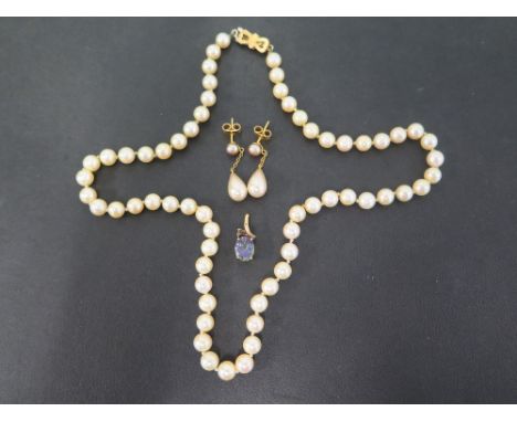 A cultured pearl single-row necklace - to the 9ct gold bow clasp - Partial hallmark - Length 46cms - A 9ct gold mystic quartz