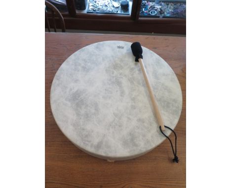 A Remo buffalo drum 56cm diameter 9.5cm deep and drum stick